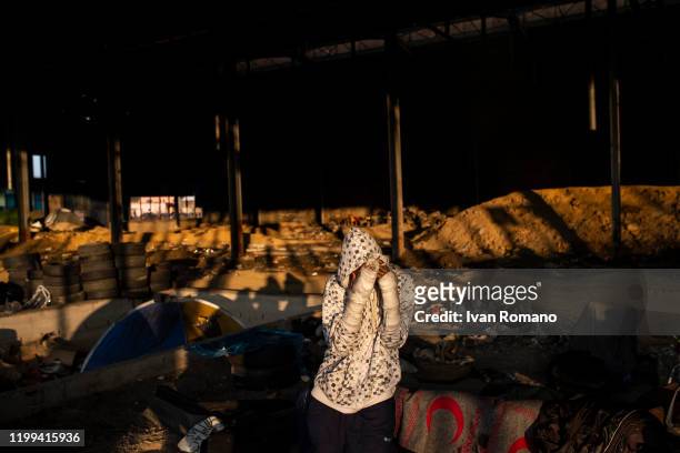 Algerian migrant named Adir inside an abandoned industrial warehouse, with his arms in plaster, after the injuries suffered by the Croatian border...