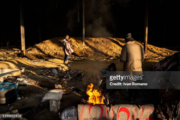 Algerian migrants in an abandoned industrial warehouse on January 12, 2020 in Velika Kladuša, Bosnia and Herzegovina. About 5,000 people are present...
