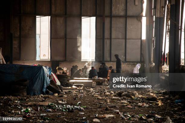 Algerian migrants in an abandoned industrial warehouse on January 12, 2020 in Velika Kladuša, Bosnia and Herzegovina. About 5,000 people are present...