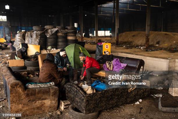 Algerian migrants in an abandoned industrial warehouse on January 12, 2020 in Velika Kladuša, Bosnia and Herzegovina. About 5,000 people are present...