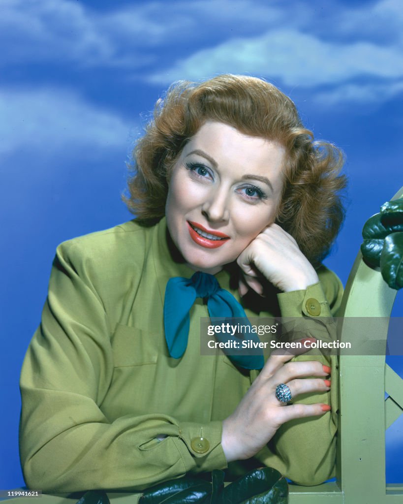 Page Garson Greer Garson , British actress, wearing a green blouse with a blue ...