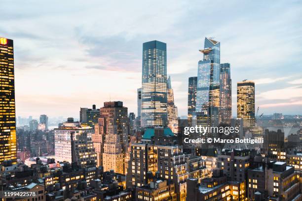 high angle view of hudson yards and west side manhattan at dusk, new york city - hudson yards fotografías e imágenes de stock