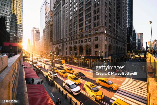 yellow taxis on 42nd street at grand central station, new york city - grand central station stock pictures, royalty-free photos & images