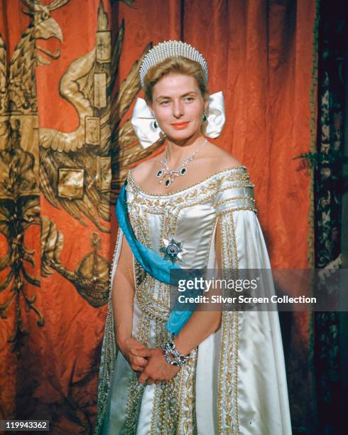Ingrid Bergman , Swedish actress, wearing a regal silk dress with a silver necklace and tiara in a publicity portrait issued for the film,...