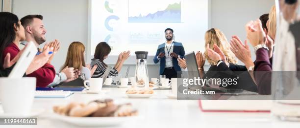 african-american man applauded after giving a business presentation - applauding leader stock pictures, royalty-free photos & images
