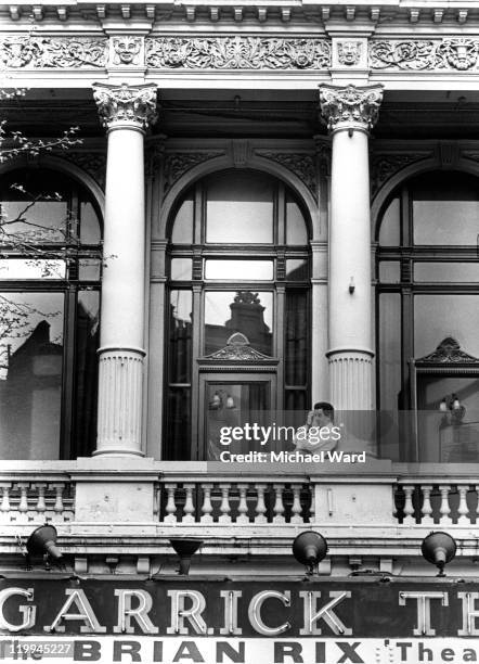 Actor Brian Rix takes a break on the balcony while playing in 'Stand By Your Bedouin', Garrick Theatre, 1967.