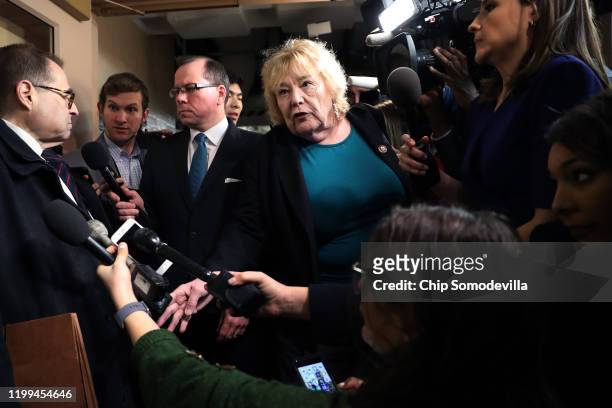 House Judiciary Committee member Rep. Zoe Lofgren moves through a crowd of journalists as they interview committee Chairman Jerrold Nadler outside...