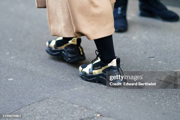 Hide & Jack" black and golden sneakers are seen, outside Reshake, during Milan Fashion Week Menswear Fall/Winter 2020/2021, on January 13, 2020 in...