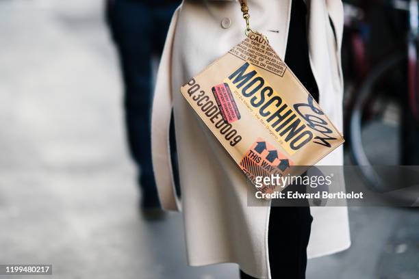 Moschino bag is seen, outside Reshake, during Milan Fashion Week Menswear Fall/Winter 2020/2021, on January 13, 2020 in Milan, Italy.