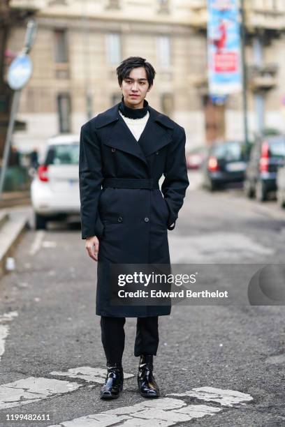 Chinese actor Yan Yu Hao, also known as Jerry Yan, wears a black double breasted long coat, a white pullover, a turtleneck, outside Reshake, during...