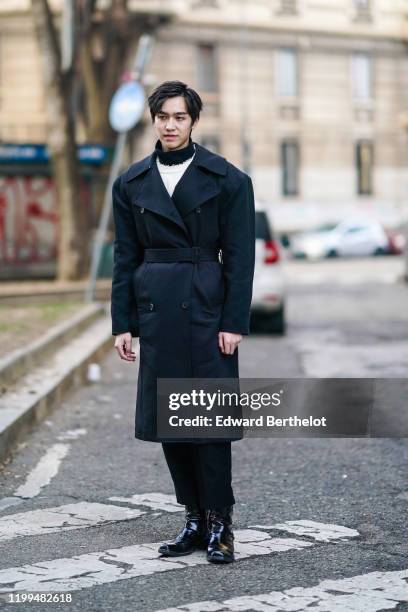 Chinese actor Yan Yu Hao, also known as Jerry Yan, wears a black double breasted long coat, a white pullover, a turtleneck, outside Reshake, during...