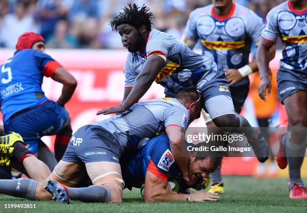 Andries Ferreira of the Bulls tackled by Jaco Coetzee of the Stormers and Scarra Ntubeni of the Stormers during the Super Rugby match between DHL...