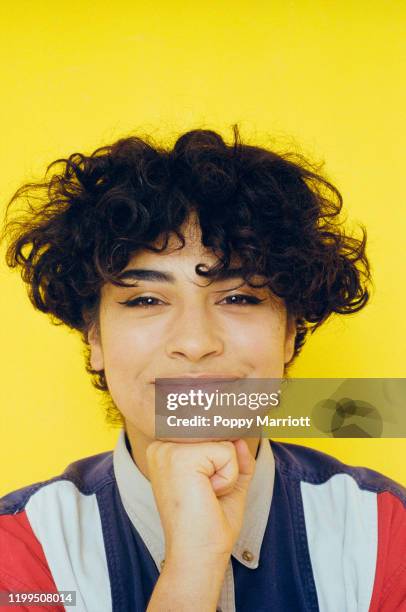 colourful studio portrait of a young non-binary individual - gender fluid fotografías e imágenes de stock