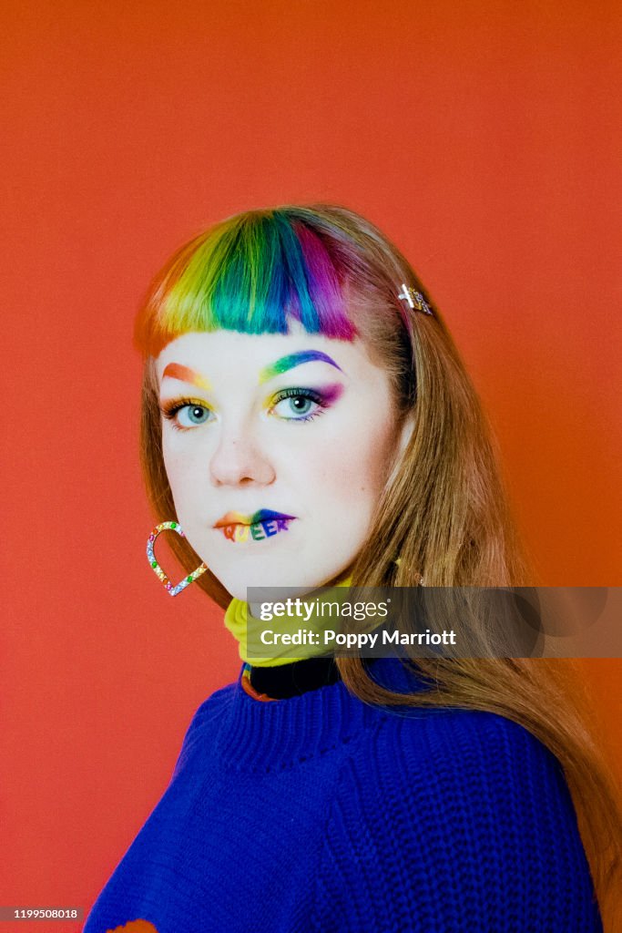 Colourful studio portrait of a young lgbtq+ individual