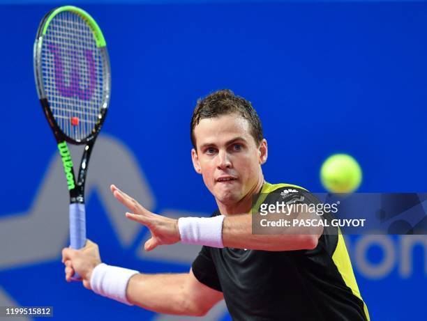 Canada's Vasek Pospisil returns the ball to Belgium's David Goffin during their semi-final tennis match at the Open Sud de France ATP World Tour in...