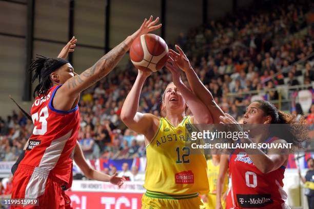 Australian's wing Sara Blicavs fights for the ball with Puerto Rico's wing Yolanda Jones and Puerto Rico's leader Jennifer O'Neill during the FIBA...