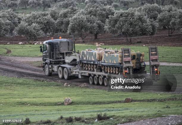 Photo taken from Turkey's Hatay province shows Turkish military convoy consisting of approximately armored personnel carriers, 5 bus commandos with...