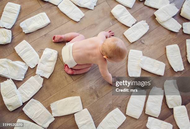 baby and diapers - diaper stock pictures, royalty-free photos & images