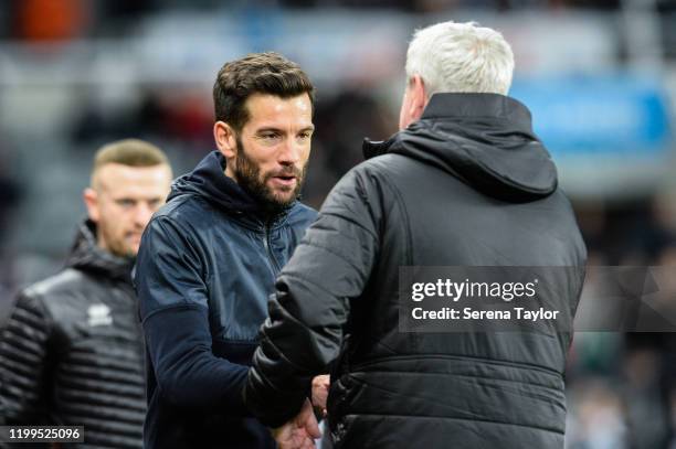 Rochdale AFC Manager Brian Barry-Murphy congratulates Newcastle United Head Coach Steve Bruce during the FA Cup Third Round Replay match between...