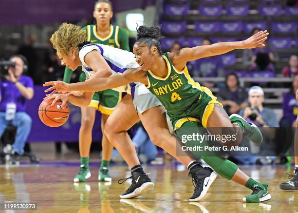 Te'a Cooper of the Baylor Lady Bears reaches in for the ball against Savannah Simmons of the Kansas State Wildcats during the first quarter on...