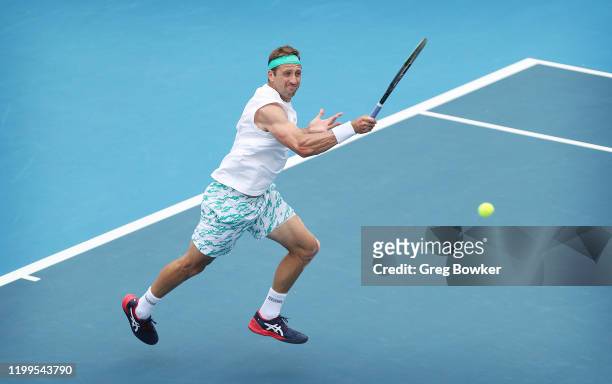 Tennys Sandgren of USA plays a forehand against John Isner of USA during day three of the 2020 Men's ASB Classic at ASB Tennis Centre on January 15,...