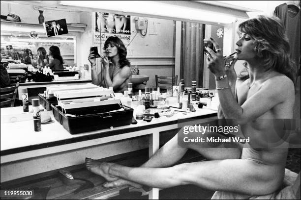 Marilyn Chambers applying lipstick in the dressing room of the Boulevard Theatre, a small theatre which shared premises with the Raymond Revuebar,...