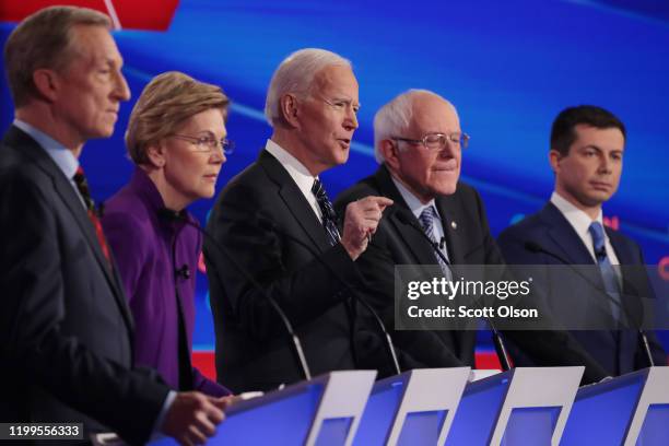 Tom Steyer , Sen. Elizabeth Warren , Sen. Bernie Sanders and former South Bend, Indiana Mayor Pete Buttigieg listen as former Vice President Joe...