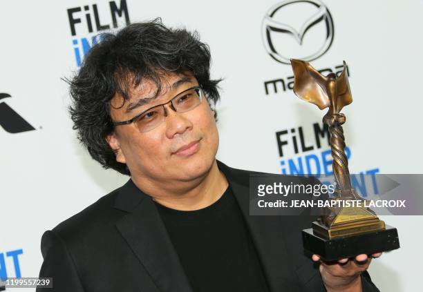Winner of Best International Film "Parasite" South Korean film director Bong Joon Ho poses in the press room during the 35th Film Independent Spirit...