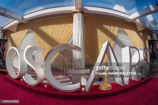 An Oscars sign and statue are displayed on the red carpet area on the eve of the 92nd Oscars ceremony at the Dolby Theatre in Hollywood, California,...