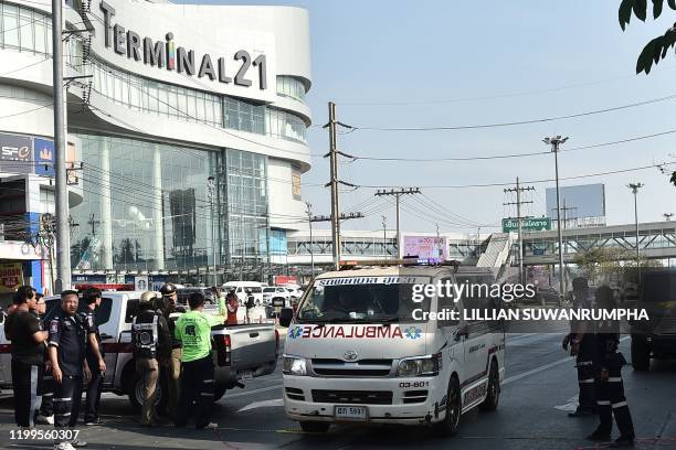 An ambulance leaves from the Terminal 21 mall, where a mass shooting took place and the gunman is currently still hiding, in the Thai northeastern...