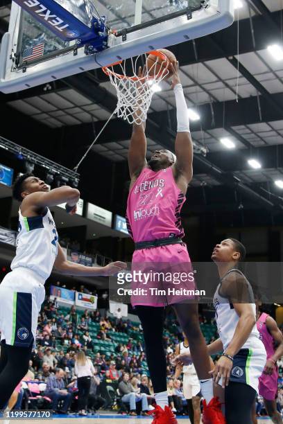 Chad Brown of the Texas Legends dunks over Tyus Battle of the Iowa Wolves and L. G. Gill of the Iowa Wolves during the third quarter on February 08,...