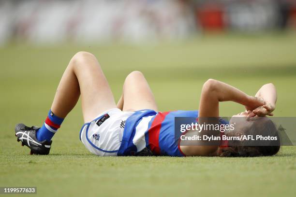 Naomi Ferres of the Bulldogs lays injured during the 2020 AFLW Round 01 match between the St Kilda Saints and the Western Bulldogs at RSEA Park on...