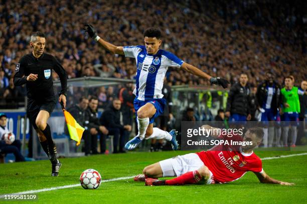 Porto's player Luiz Díaz and SL Benfica's player Ferro are seen in action during a football match for the Portuguese first league between FC Porto...