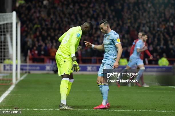 Brice Samba of Nottingham Forest drops the ball and has to chase down Jack Harrison of Leeds United during the Sky Bet Championship match between...