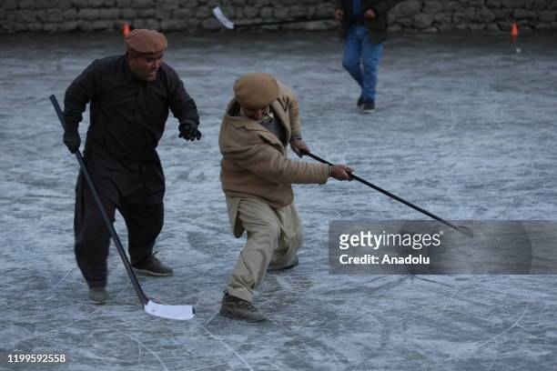Burusho and Wakhi people living in Hunza valley of Gilgit-Baltistan, play ice hockey as they start to live in mountainous regions that have a height...