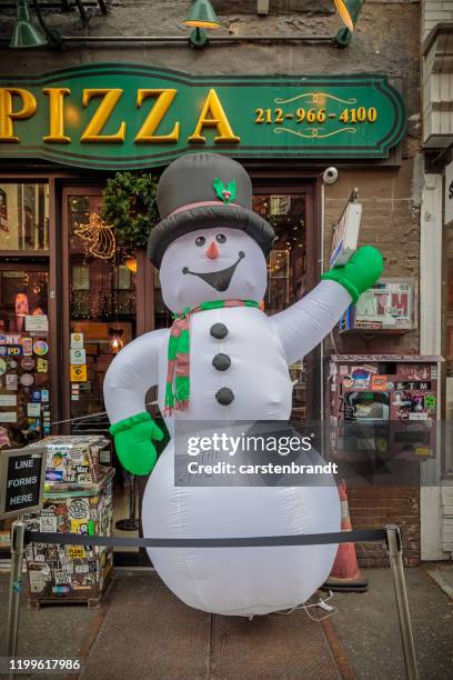 inflatable snowman with an attitude - inflatable santa stock pictures, royalty-free photos & images