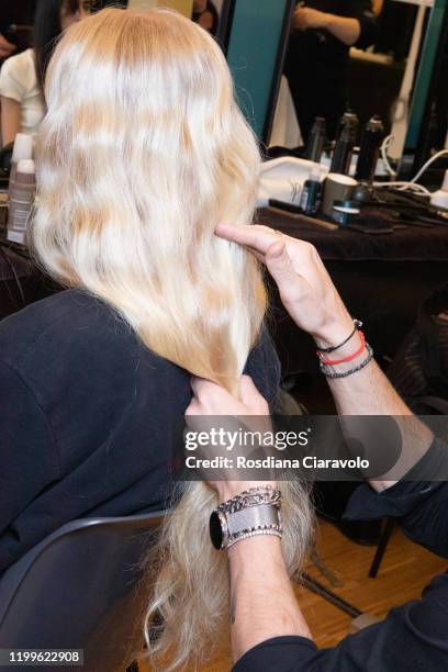 Model, hair detail, is seen backstage at the Marco De Vincenzo fashion show on January 14, 2020 in Milan, Italy.