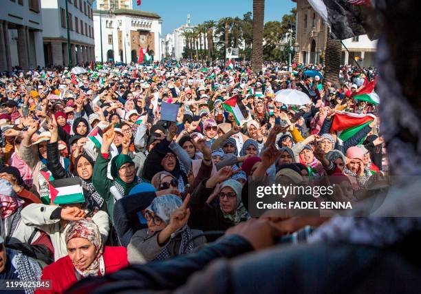 Moroccans march during a demonstration against the US Middle East peace plan in the capital Rabat on February 9, 2020. - Morocco has warming but...