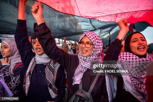 Moroccan women attend a demonstration against the US Middle East peace plan in the capital Rabat on February 9, 2020. - Morocco has warming but quiet...