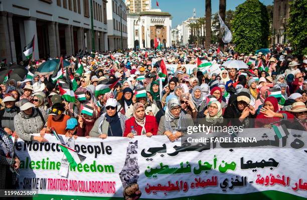 Moroccans march during a demonstration against the US Middle East peace plan in the capital Rabat on February 9, 2020. - Morocco has warming but...