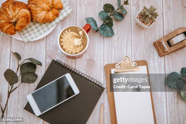 overhead shot open blank notebook and coffee with autumn leaves and march calendar - blank book on desk stock-fotos und bilder