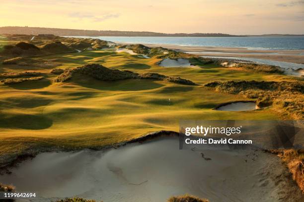 View from behind the green on the par 3, 13th hole with the par 4, 17th hole behind on the Barnbougle Dunes Golf Links course on December 16, 2019 in...