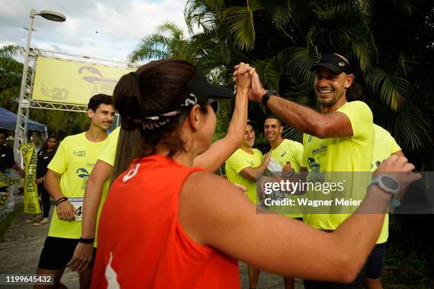 The winning team celebeate as running group Filhos do Vento take part in their organized 12-hour uninterrupted race against cancer at Rodrigo de...