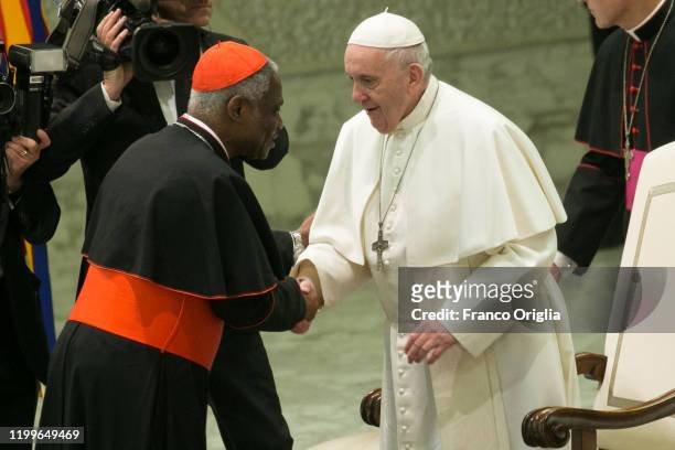 Pope Francis greets Cardinal Peter Appiah Turkson during his weekly audience at the Paul VI Hall on January 15, 2020 in Vatican City, Vatican.