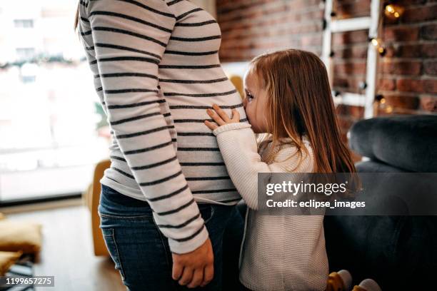 i can not wait to be sister - belly kissing stock pictures, royalty-free photos & images