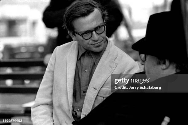 American film director, producer, and screenwriter Sidney Lumet talks with an unidentified man on the set of his film 'The Pawnbrowker,' New York,...