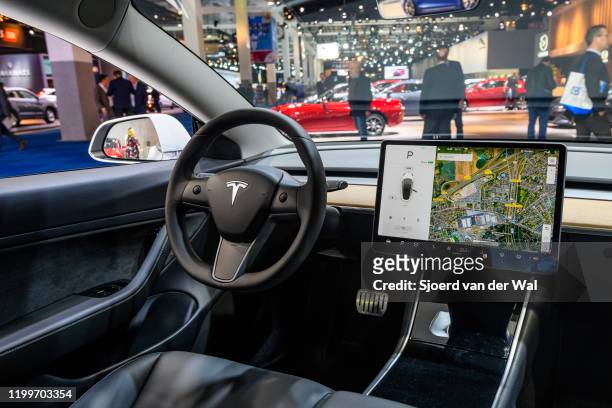 Tesla Model 3 compact full electric car interior with a large touch screen on the dashboard on display at Brussels Expo on January 9, 2020 in...