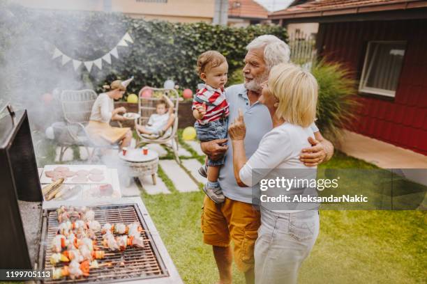 barbecue party in our yard - family barbeque garden stock pictures, royalty-free photos & images