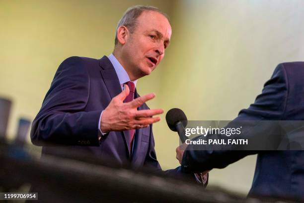 Leader of Ireland's Fianna Fail party, Micheal Martin gives an interview inside the count centre in Cork, where he is seeking to be re-elected in...