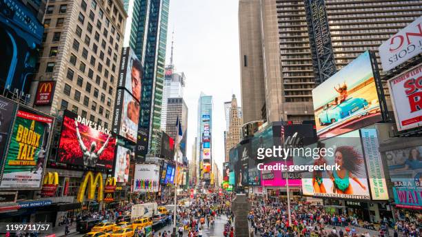 wide angle on times square, new york city - broadway manhattan stock pictures, royalty-free photos & images